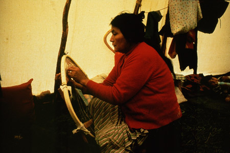Nishet Penashue lacing snowshoes at her camp in the Akamiupishku region in the fall of 1977. Photo Nigel Markham. Courtesy Innu Nation.