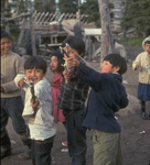 Innu boys playing with slingshots, 1966-68. From the right, Tatias Rich, Kashetan Rich, and the late Matiu Rich (photo Georg Henriksen).